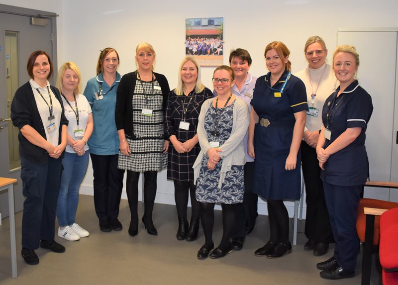Lindsey Lodge Hospice Director of Nursing and Patient Services Maureen Georgiou (fourth from left) and Medical Director Dr Lucy Adcock (fifth from right) are pictured with hospice staff and local health partners involved in the Breathe Easy Enablement Programme.