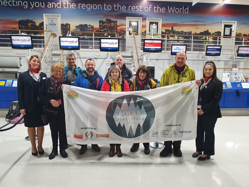 Polar Trekkers Trevor Zimmerman (third from left); Stuart Birkitt (fourth from left); Samantha Osbourne (front centre); Ian Chambers (back centre); Pam Atkin (third from right) and Andy Lindsey (second from right) are pictured with Hospice Fundraiser Anne Millet (second left) and Swiss Port check-in staff before flying out for their charity expedition.