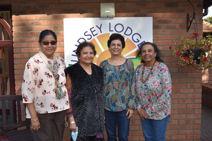 Four ladies from Scunthorpe Cultural Society smile for a photo taken outside Lindsey Lodge Hospice and Healthcare