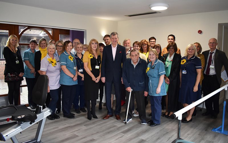 Allan Clarke (centre) is pictured with patients, staff and volunteers in the Lindsey Lodge Hospice Enablement Gym
