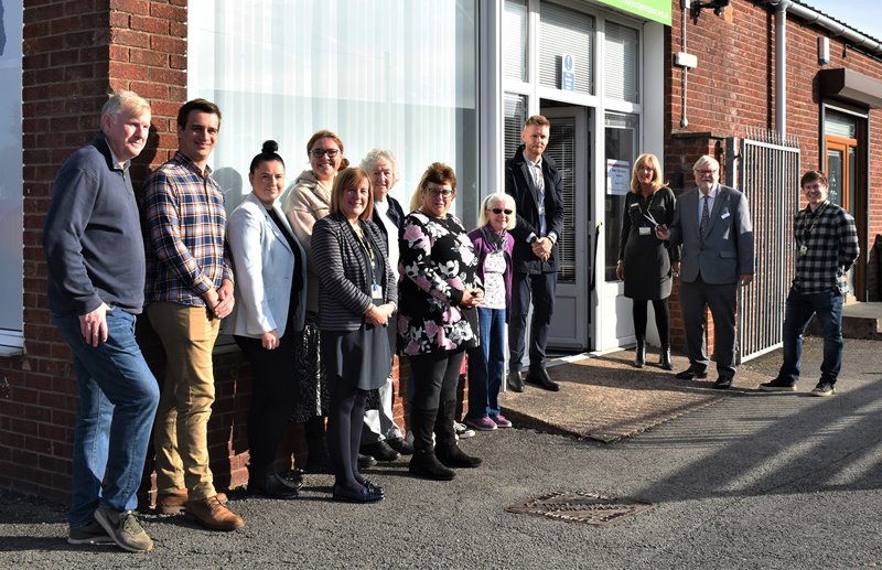 Lindsey Lodge Chairman Alan Bell (second right) is joined by Chief Executive Karen Griffiths (third right), Deputy Chief Executive Tom Moody (fourth right) and staff and volunteers at the official opening of the Lindsey Lodge Charity Warehouse Retail Shop.