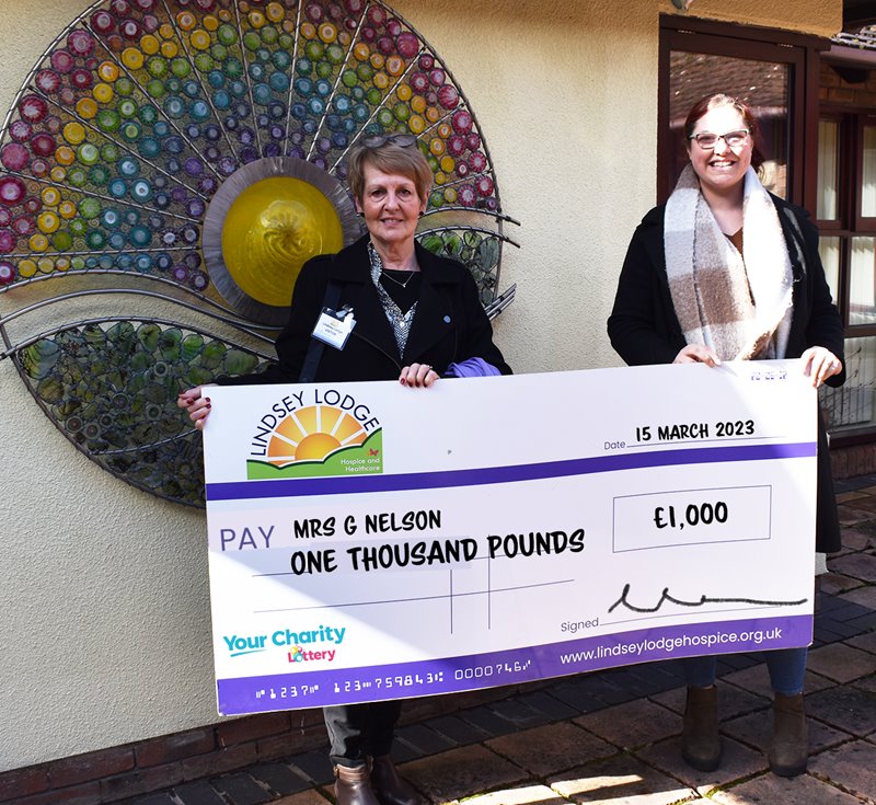 Mrs Nelson pictured with her cheque with fundraiser Emma Hartley