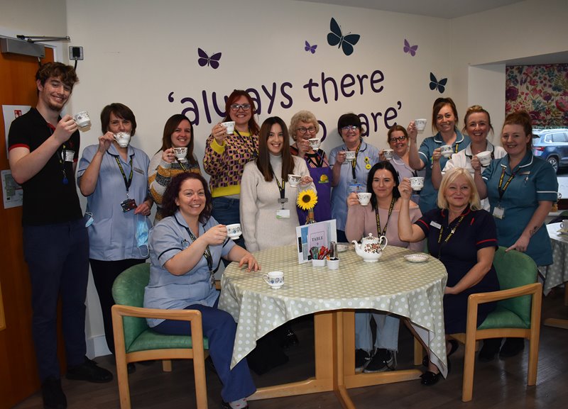 Staff from Lindsey Lodge Hospice & Healthcare are pictured with Volunteer Jill Perry (seventh from left/centre)