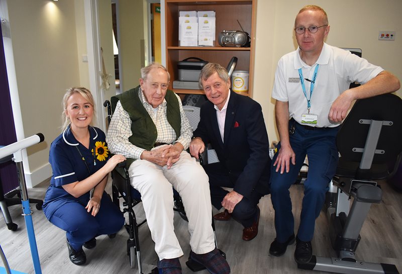 Allan Clarke (second right) is pictured with Wellbeing Patient Michael Peace (second) Wellbeing Centre Manager Sarah Hodge (left) and Physiotherapist Matthew Bontoft (right).