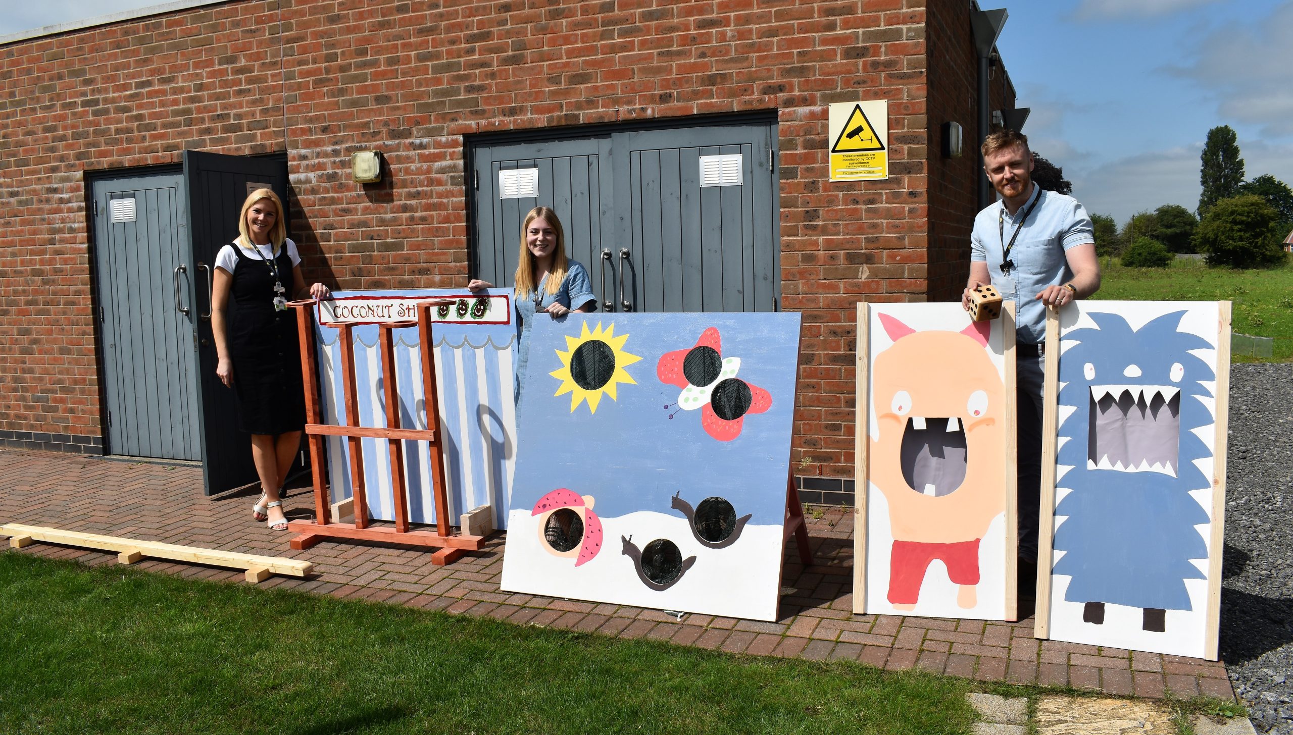 Staff pictured with games