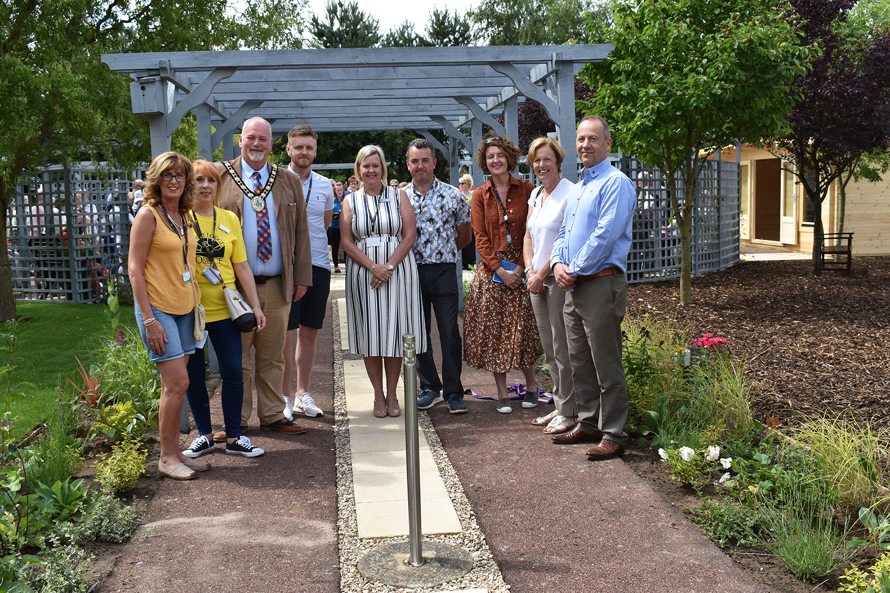 A group of people pictured in the garden