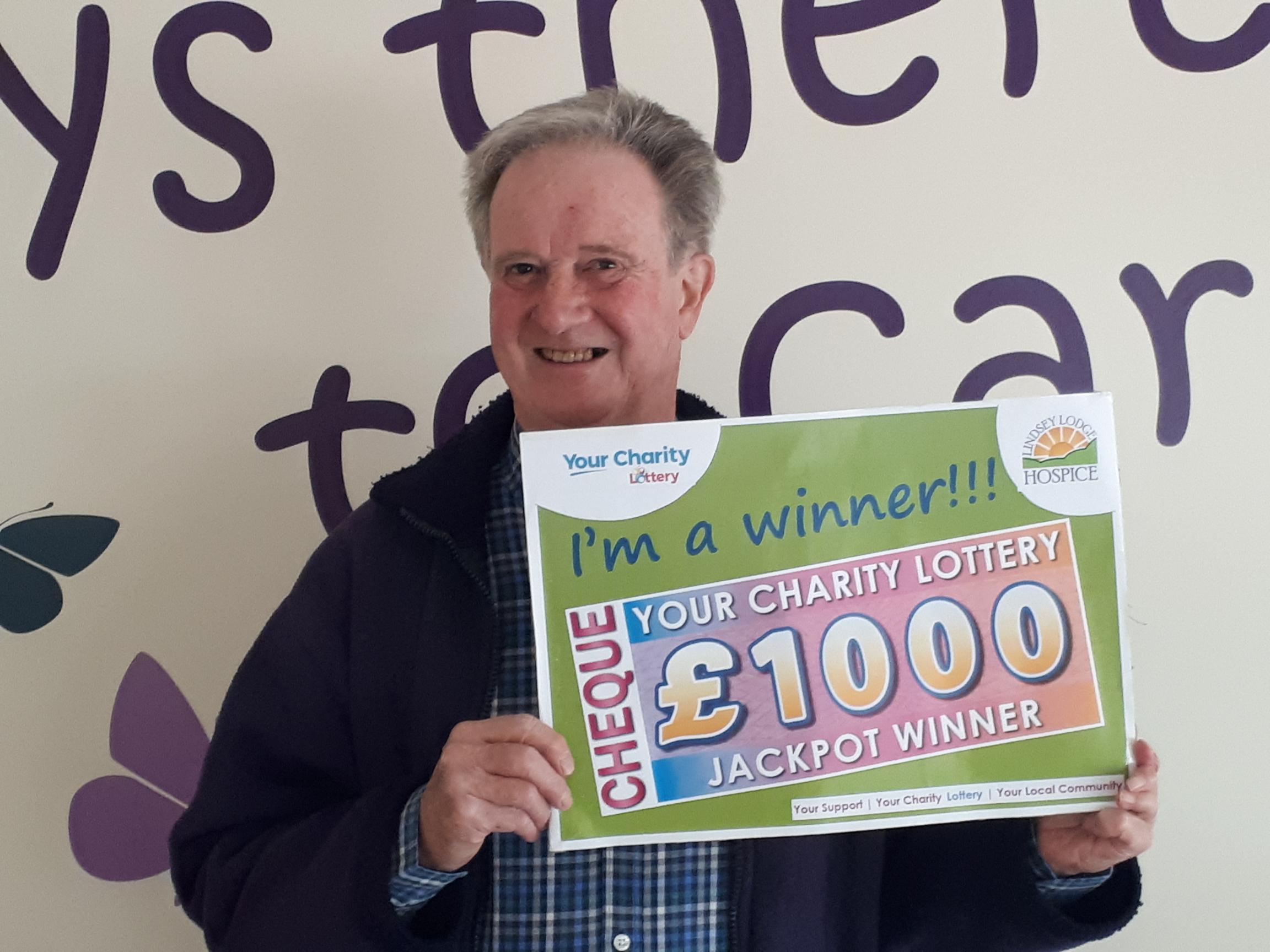 Photo of paul ashley with cheque