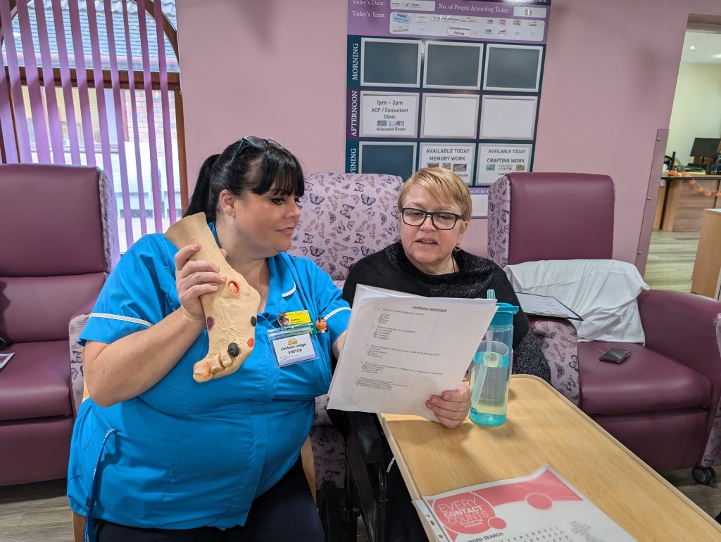 pressure prevention team nurse Heather Webster talks to a lindsey lodge patient about pressure ulcers